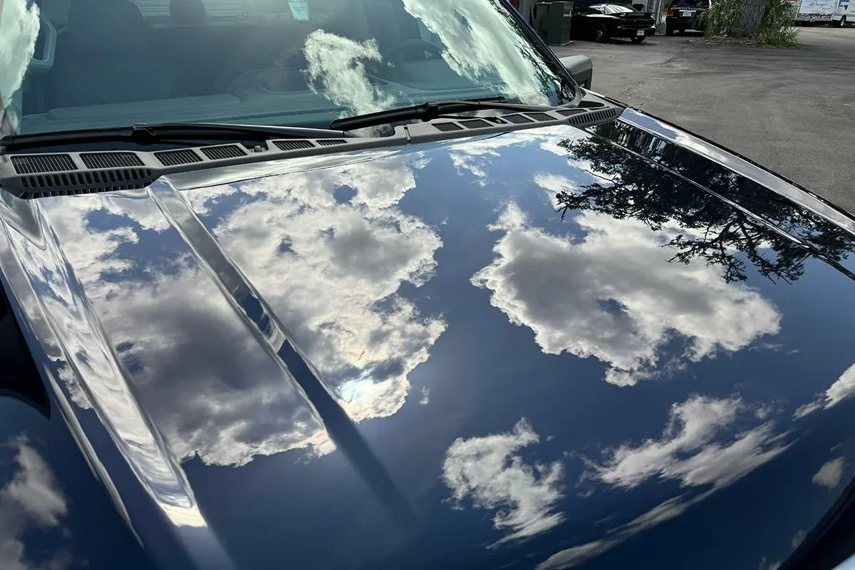 glossy clean car paint reflection after proper wash and pre wash